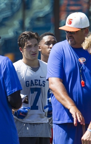 Bishop Gorman running back Baggio Ali Walsh (7) listens in to his coach during team practice ...