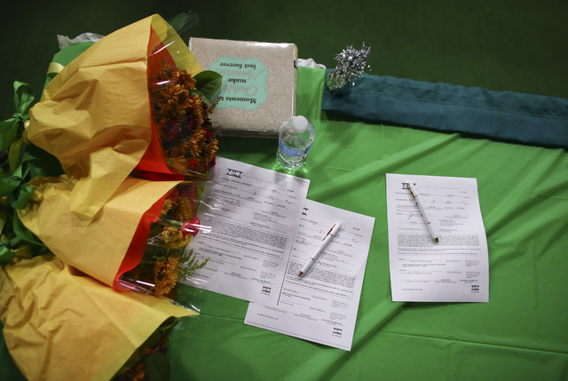 National letters of intent sit on tables as Las Vegas area high school softball players gath ...