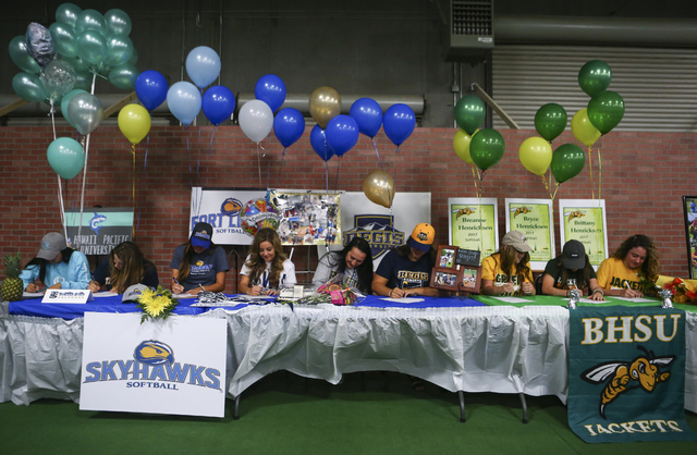 Las Vegas area high school softball players gather to sign their national letters of intent ...