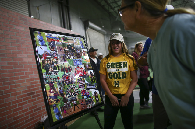 Arbor View softball player Breanne Henricksen looks on as people gather to watch Las Vegas a ...