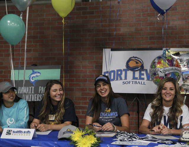 Las Vegas area high school softball players gather to sign their national letters of intent ...