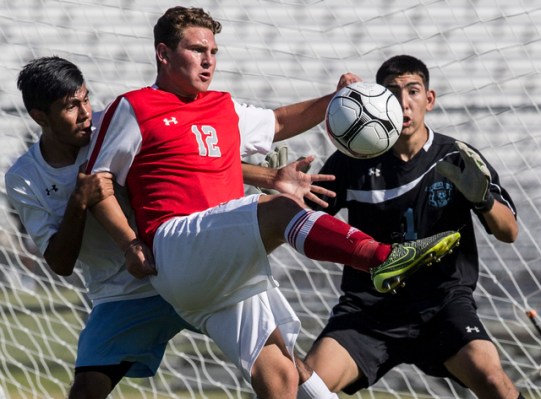 Arbor View junior midfielder Nicklaus Dongmannon (12) turns and shoots on Canyon Springs jun ...