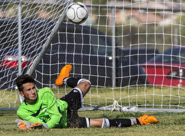 Arbor View senior goal keeper Brendan Rapp (0) punches a ball out of danger on Tuesday, Sept ...