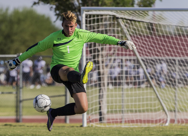 Arbor View senior goal keeper Gabriel Sano (1) clears a shot on Tuesday, Sept. 6, 2016, at C ...