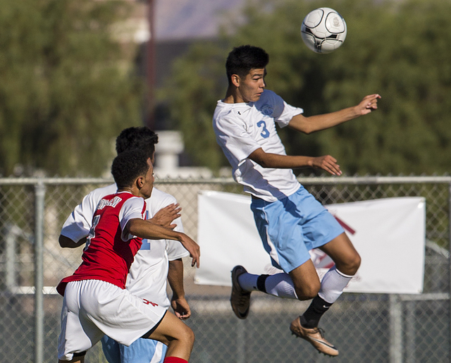Canyon Springs junior midfielder Chris Lopez (3) leaps for a header on Tuesday, Sept. 6, 201 ...