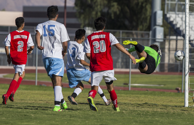 Arbor View senior goal keeper Gabriel Sano (1) watches a shot hit the cross bar on Tuesday, ...