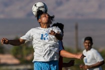 Canyon Springs junior midfielder Alejandro Perez (12) leaps for a header on Tuesday, Sept. 6 ...