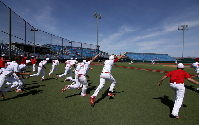 The Liberty Patriots celebrate after defeating Centennial 5-3 for the Division I state title ...