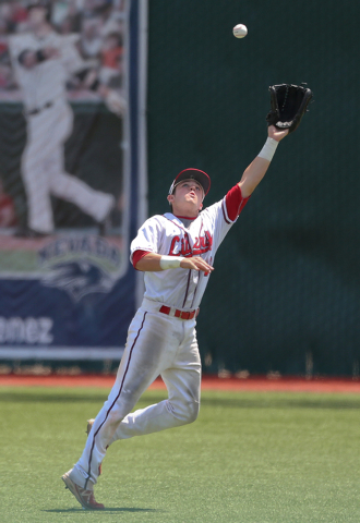Liberty right fielder Jesse Keiser makes a catch against Centennial in the Division I state ...