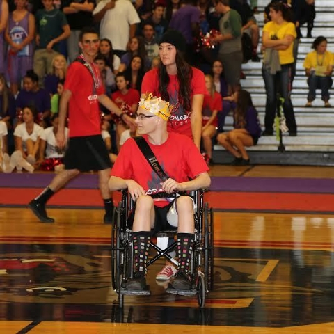 Brooke Lynn Garlick, a senior at Coronado, wheels out Michael Tatalovich at the Homecoming A ...