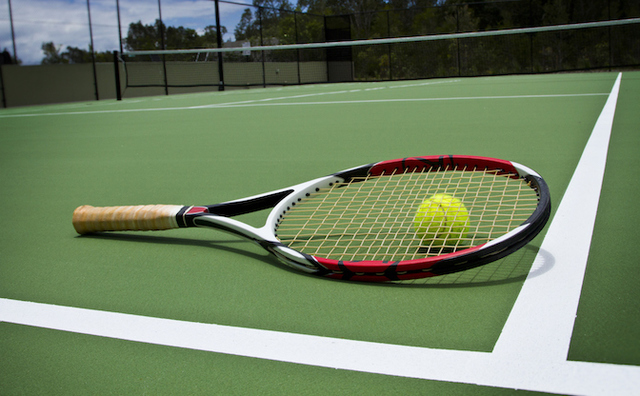 Tennis Racket and Ball on court