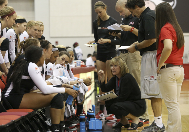 Coach Cindy Fredrick talks with her UNLV women’s volleyball players during the season ...