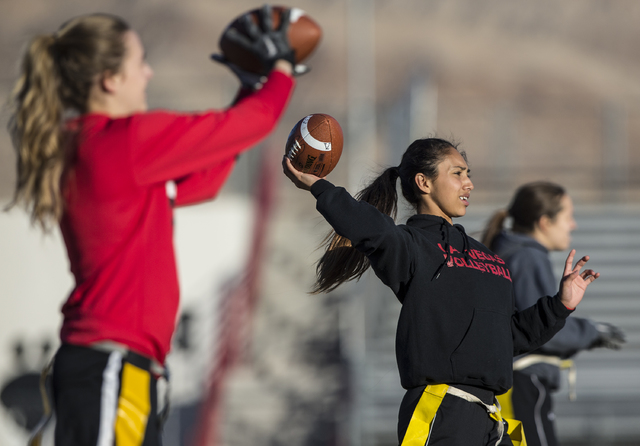 Wildcat quarterback Sabrina Saldate warms up during flag football practice at Las Vegas High ...