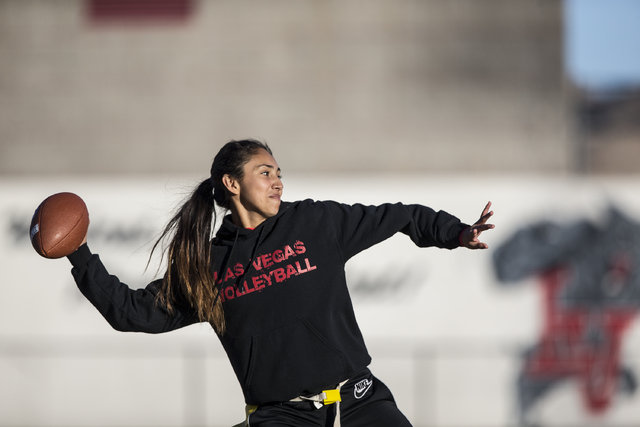 Wildcat quarterback Sabrina Saldate warms up during flag football practice at Las Vegas High ...
