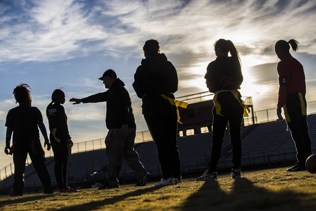 Wildcat coach Erick Capetillo explains a new play during flag football practice at Las Vegas ...