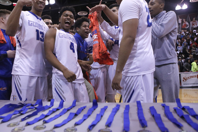 Bishop Gorman’s players react after winning a Class 4A boys state final championship g ...