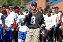 Michigan football coach Jim Harbaugh urges the more than 500 high school football players to ...