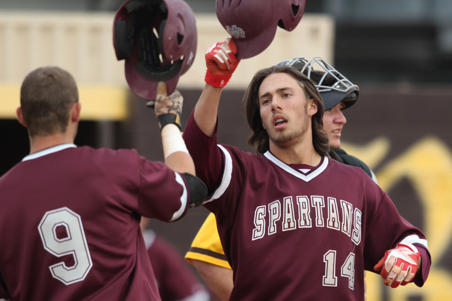 Cimarron Memorial’s Niko Decolati (14) is congratulated after his home run against Bon ...