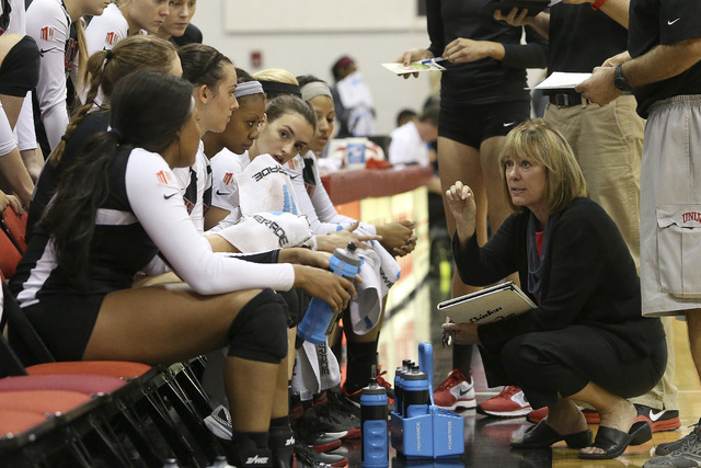 Coach Cindy Fredrick talks with her UNLV women’s volleyball players during the season ...