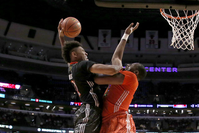 McDonald’s West All-American Kelly Oubre, left, goes up for a dunk but is fouled by Mc ...