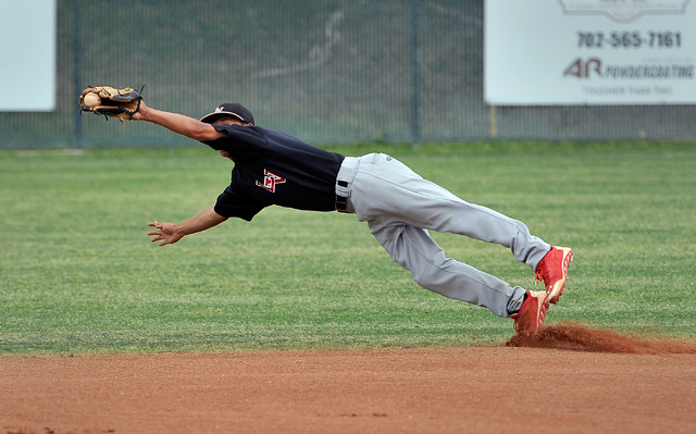 Las Vegas second baseman Mikel Smith makes a diving catch during the first inning against Sh ...
