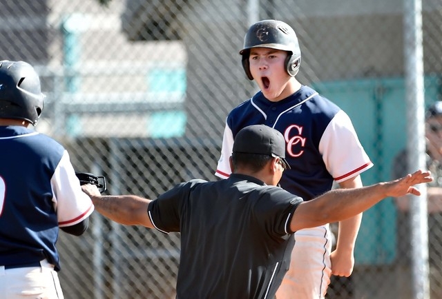 Coronado High School’s Nate Ruiz reacts after sliding safely across home plate during ...