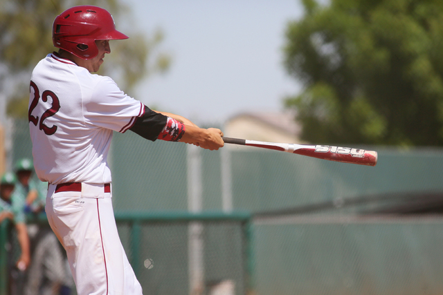 Desert Oasis senior Nolan Kingham swings to hit a home run during a baseball game against Gr ...