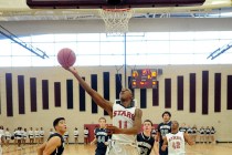 Agassi Prep guard Deishuan Booker (11) goes up for a layup against The Meadows earlier this ...