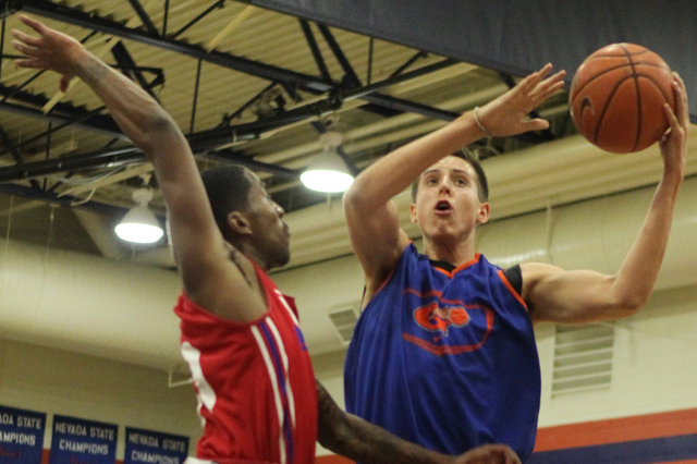 Bishop Gorman’s Zach Collins (12), right, goes up for a shot during their scrimmage ga ...