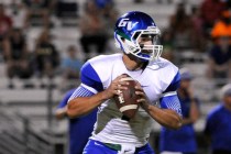 Green Valley quarterback Christian Lopez back peddles to pass during a high school football ...