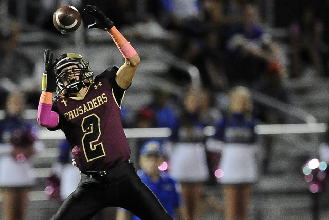 Spring Valley defenders hope to slow Faith Lutheran wide receiver Mark Rubalcaba (2) and the ...
