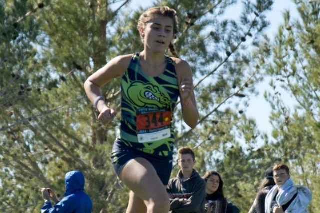 Mia Smith of Green Valley High School finishes first during the girls Division I Sunrise cro ...