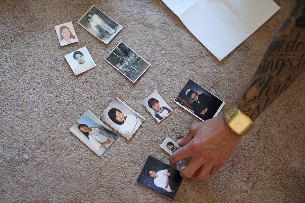 Jerome Penaranda shows pictures of his family at his Las Vegas home, Thursday, March 7, 2019. ( ...