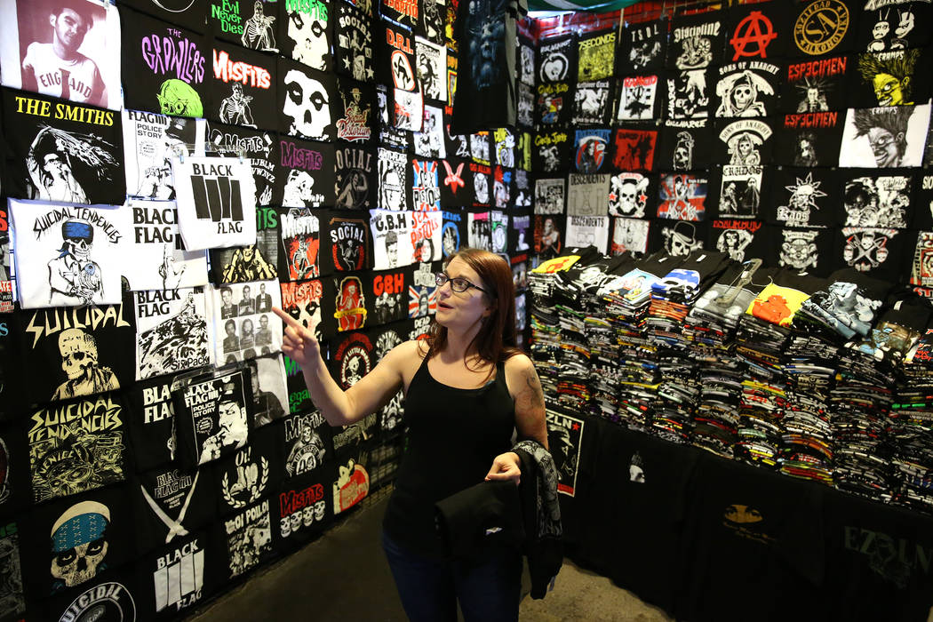 Customer Michelle Foulks of Salt Lake City, Utah, looks for a shirt at the Latino's Rock booth ...