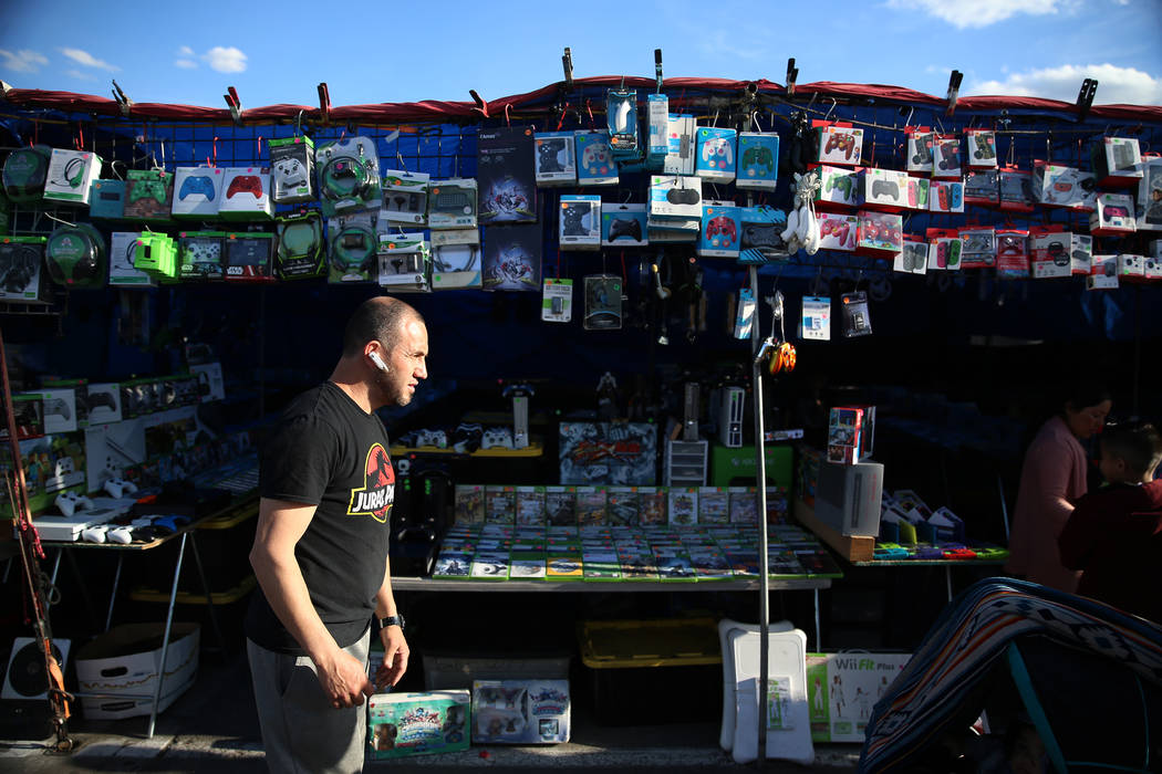 Carlos Figueroa, owner of Alexis Video Games, stands in front of his booth at the Broadacres Ma ...