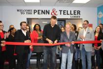 Penn Jillette, left, with Teller, of Penn & Teller cut the ribbon in the lobby of the new AFAN ...