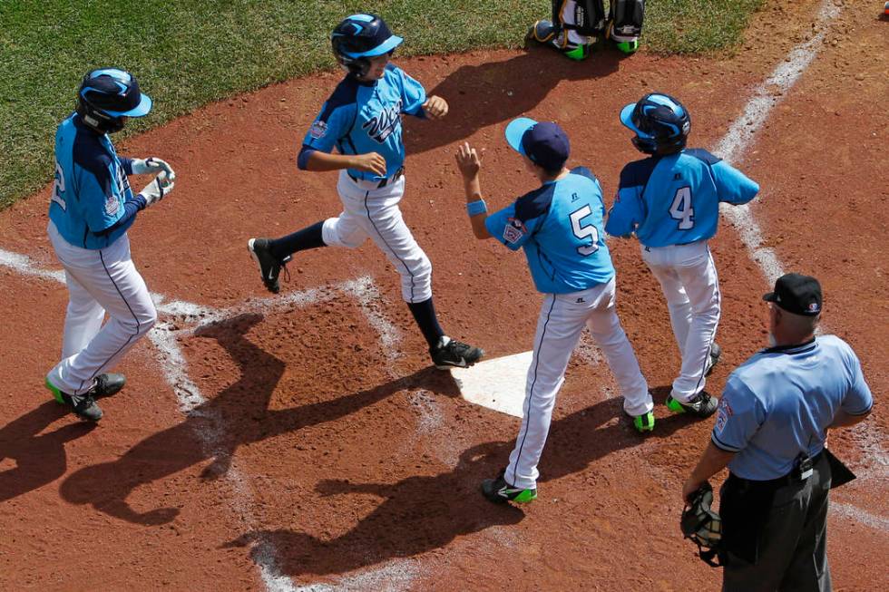 Las Vegas' Dominic Clayton, second from left, celebrates with after hitting a two-run home run ...