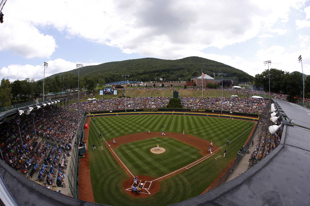 In this photo taken with a fisheye lens Lamade Stadium is filled to capacity to watch a basebal ...