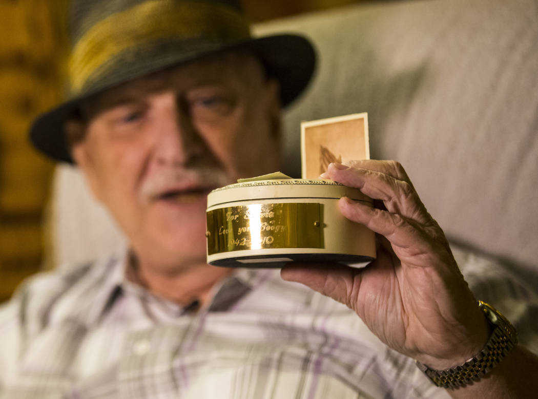 Jerry Kaczmarek holds a container with the partial remains of longtime friend Charles "Boo ...