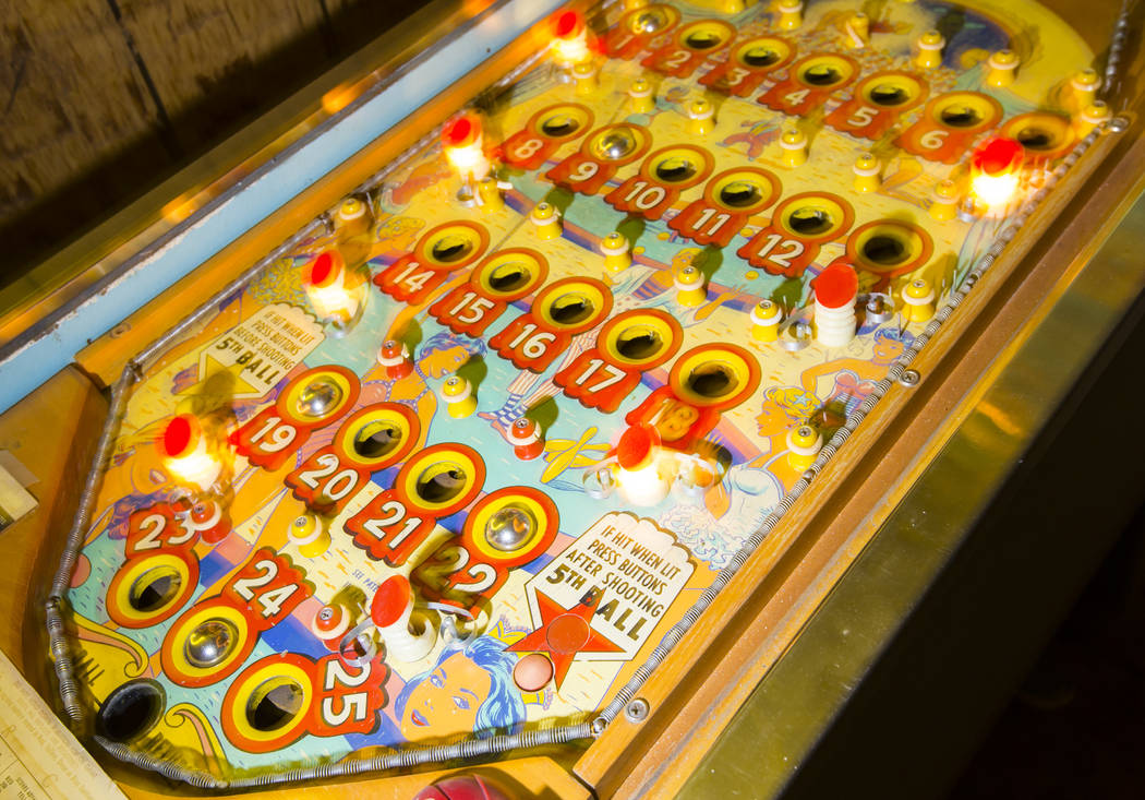 Jerry Kaczmarek plays on the "Circus Queen" bingo pinball machine at his home in Bull ...
