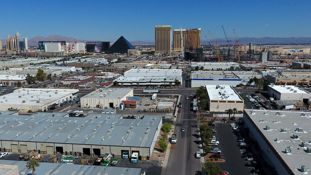 Aerial view of Raiders stadium, center, in Las Vegas as it continues to take shape between a la ...