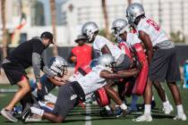 UNLV wide receiver Andre Collins Jr., right, works through a drill with Mekhi Stevenson during ...