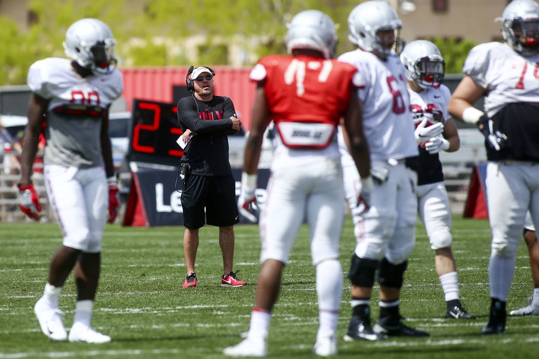 UNLV Rebels head coach Tony Sanchez watches his team during the spring football game at Peter ...