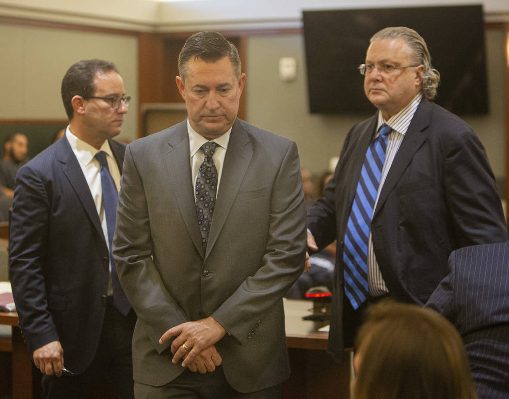 Scott Gragson, center, walks out of court after his hearing for a fatal DUI with his attorneys ...