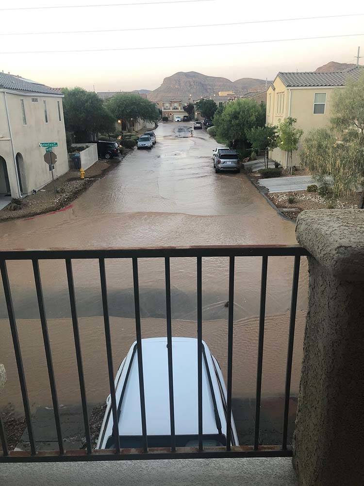 Streets remain flooded in Mountain's Edge in southwest Las Vegas on Thursday morning, Aug. 1, 2 ...