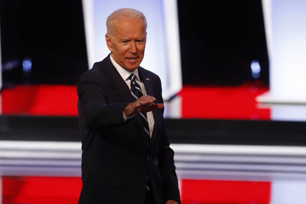 Former Vice President Joe Biden waves after the second of two Democratic presidential primary d ...