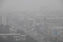 Heavy smoke covers the center of the eastern Siberian city of Chita, Russia, Thursday, Aug. 1, ...