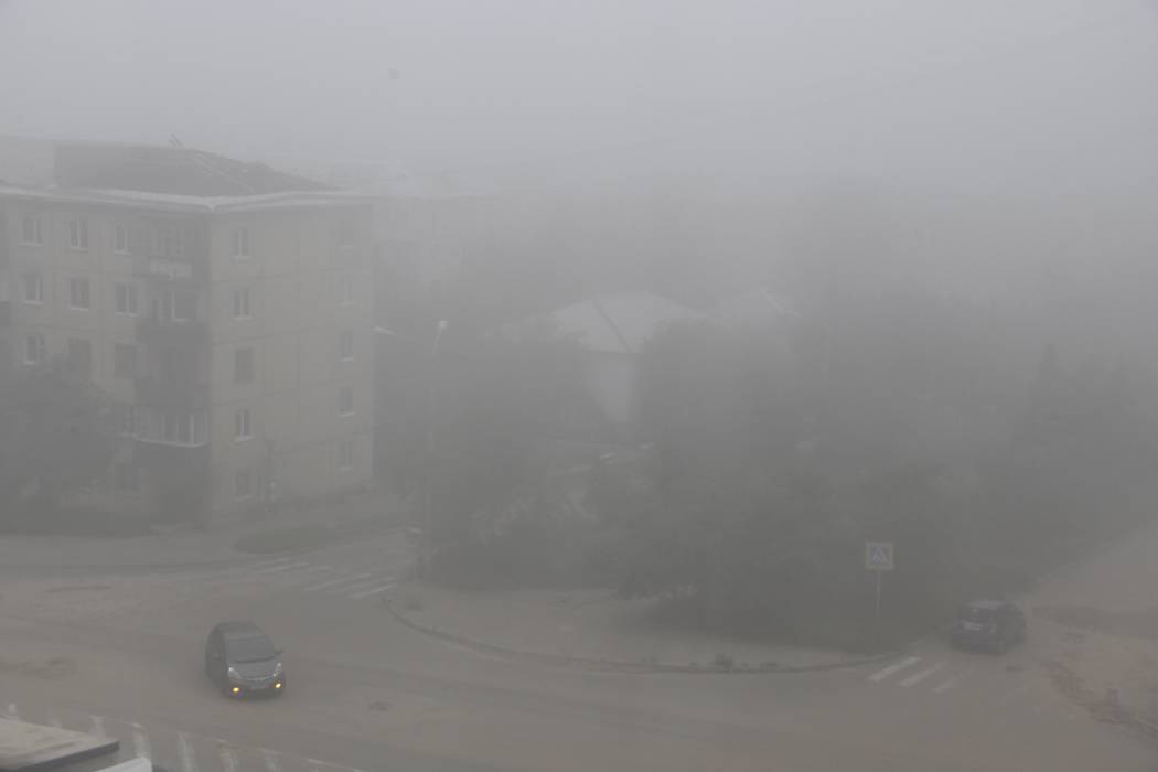 Heavy smoke covers the center of the eastern Siberian city of Chita, Russia, Thursday, Aug. 1, ...