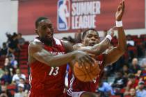 Miami Heat's Bam Adebayo (13) grabs a rebound next to Miami Heat's Matt Williams (54) during a ...