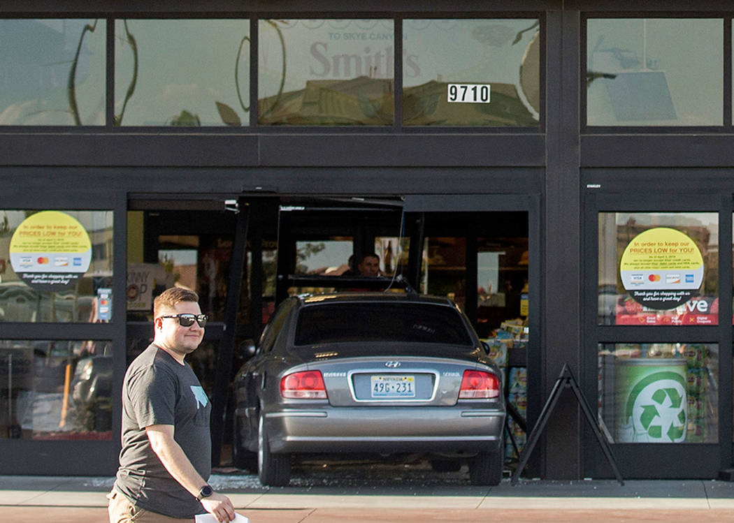 A car crashes into the Smith’s Marketplace, at 9710 West Skye Canyon Park Drive, Wednesd ...